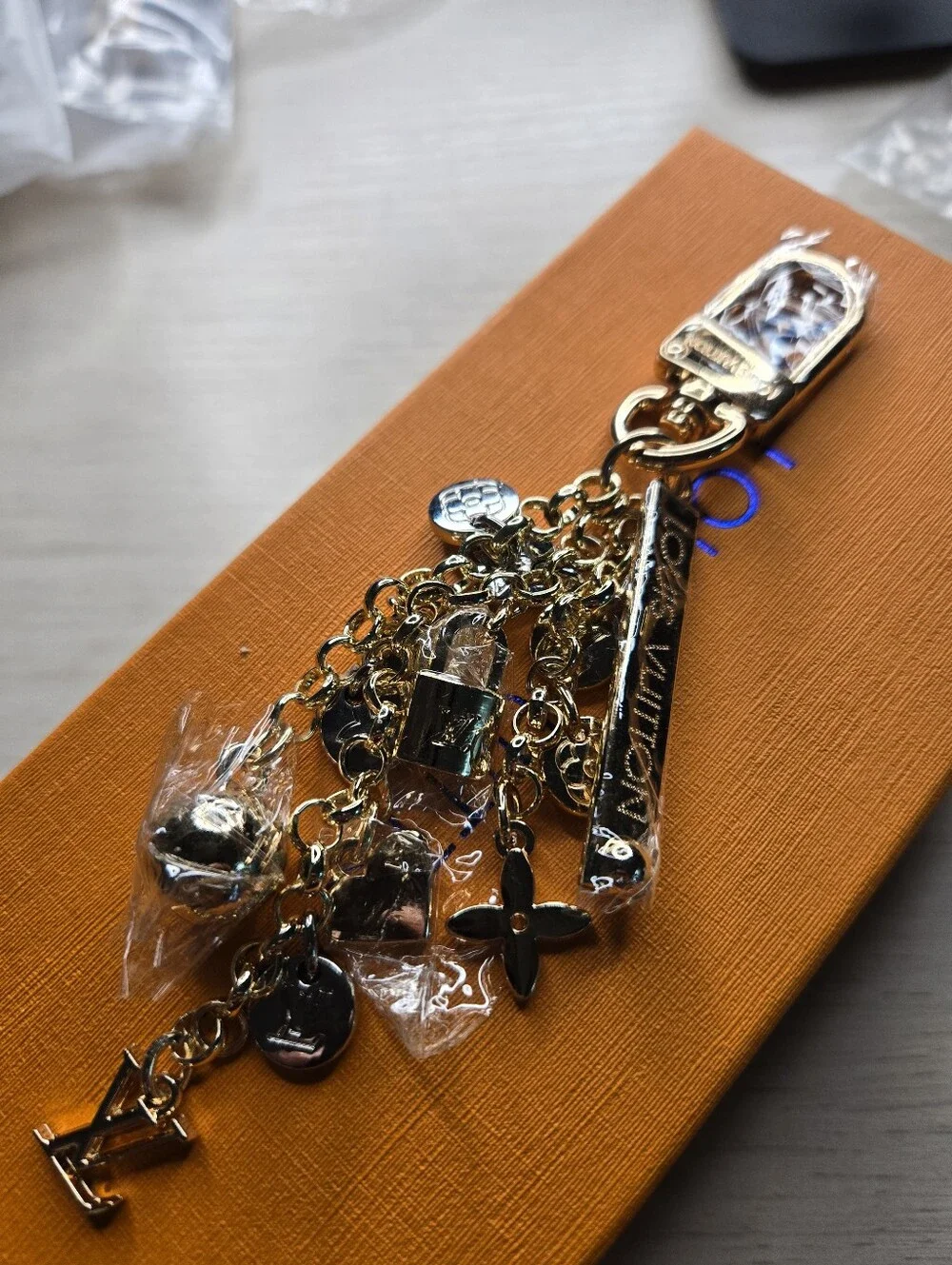 Louis Vuitton Gold-Tone Charm Keychain - Gold